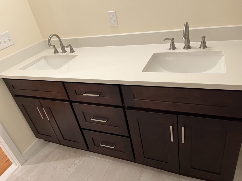 Espresso double vanity with white quartz top, bathroom remodel by Middletown Bath Co.