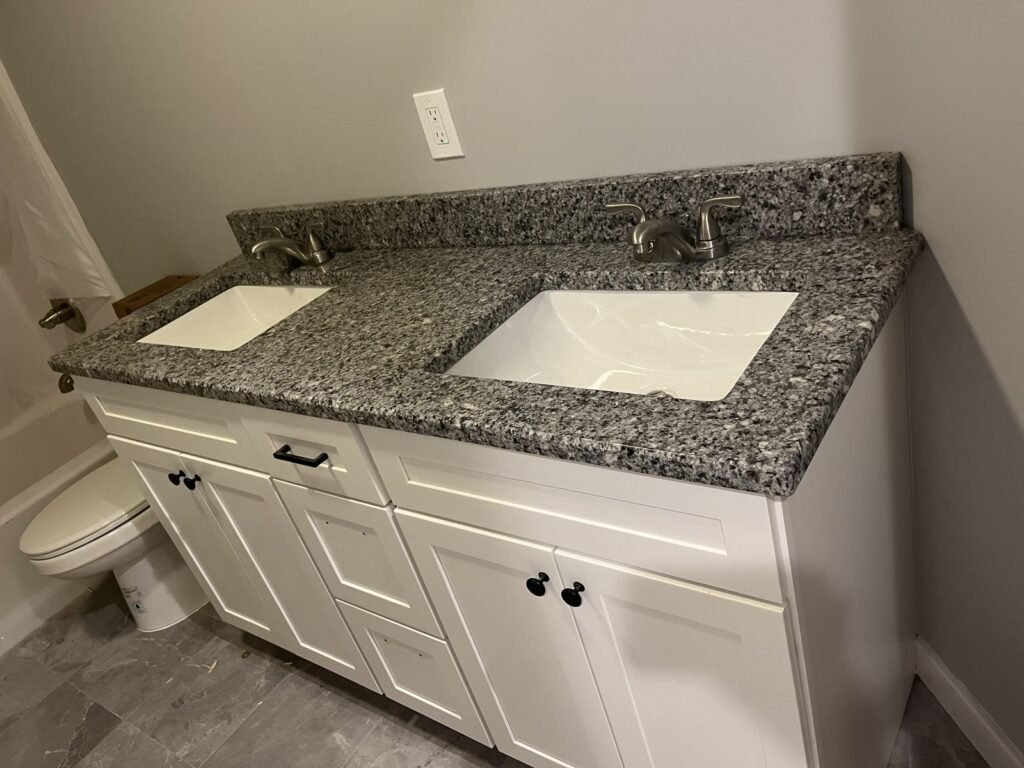 White shaker double vanity with gray granite top, bathroom remodel by Middletown Bath Co.